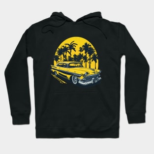 yellow classic car 1960s with palm trees at sunset Hoodie